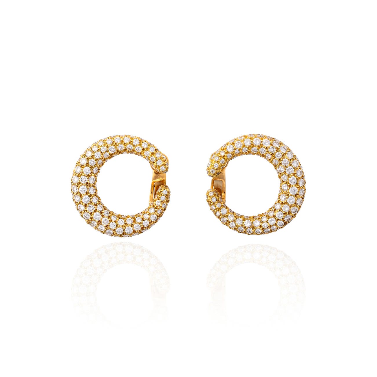 <p><strong>CARTIER</strong> <em>Pair of diamond and gold earrings</em></p>