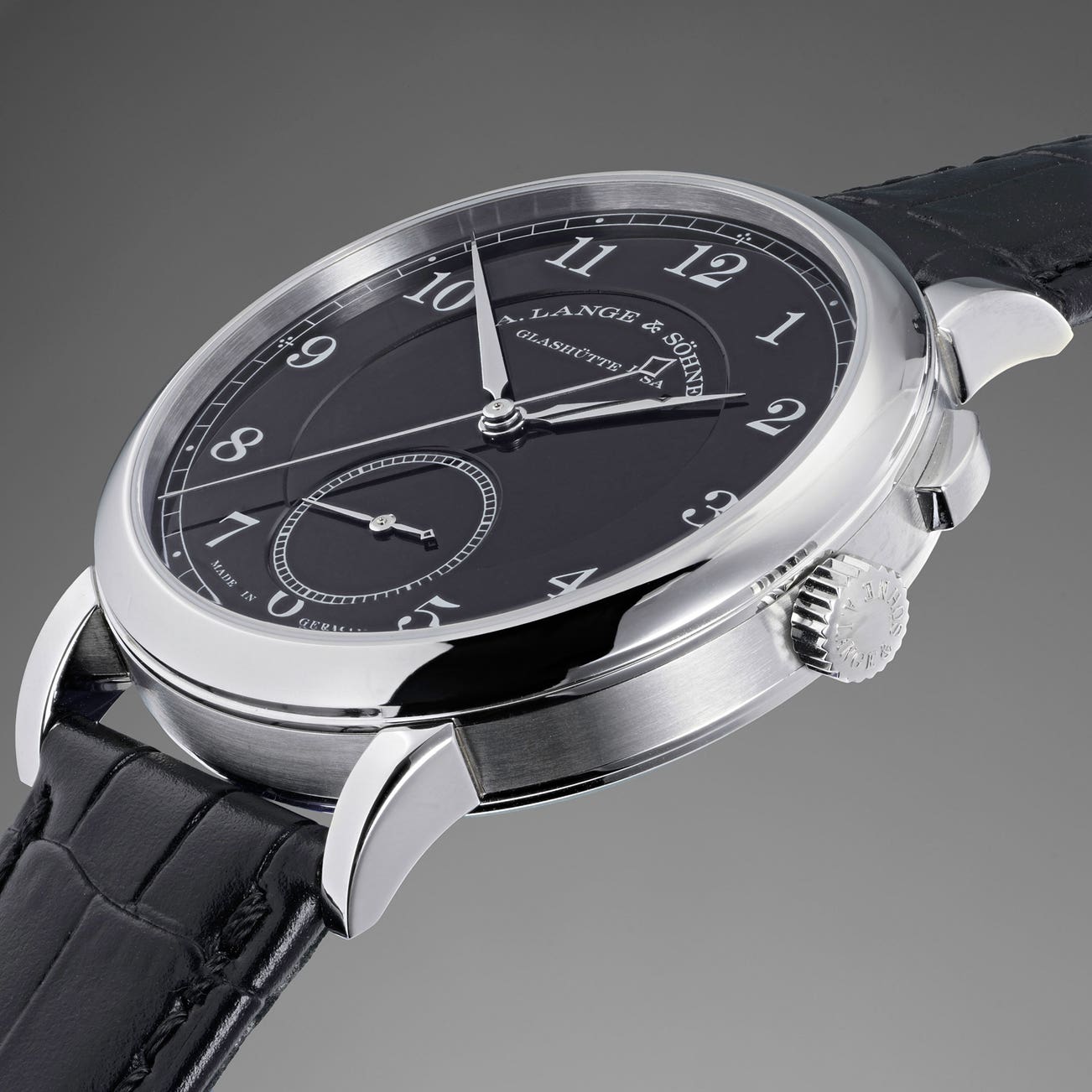A unique and highly attractive stainless steel A. Lange &amp; Söhne wristwatch with independently stoppable jumping seconds and black enamel dial