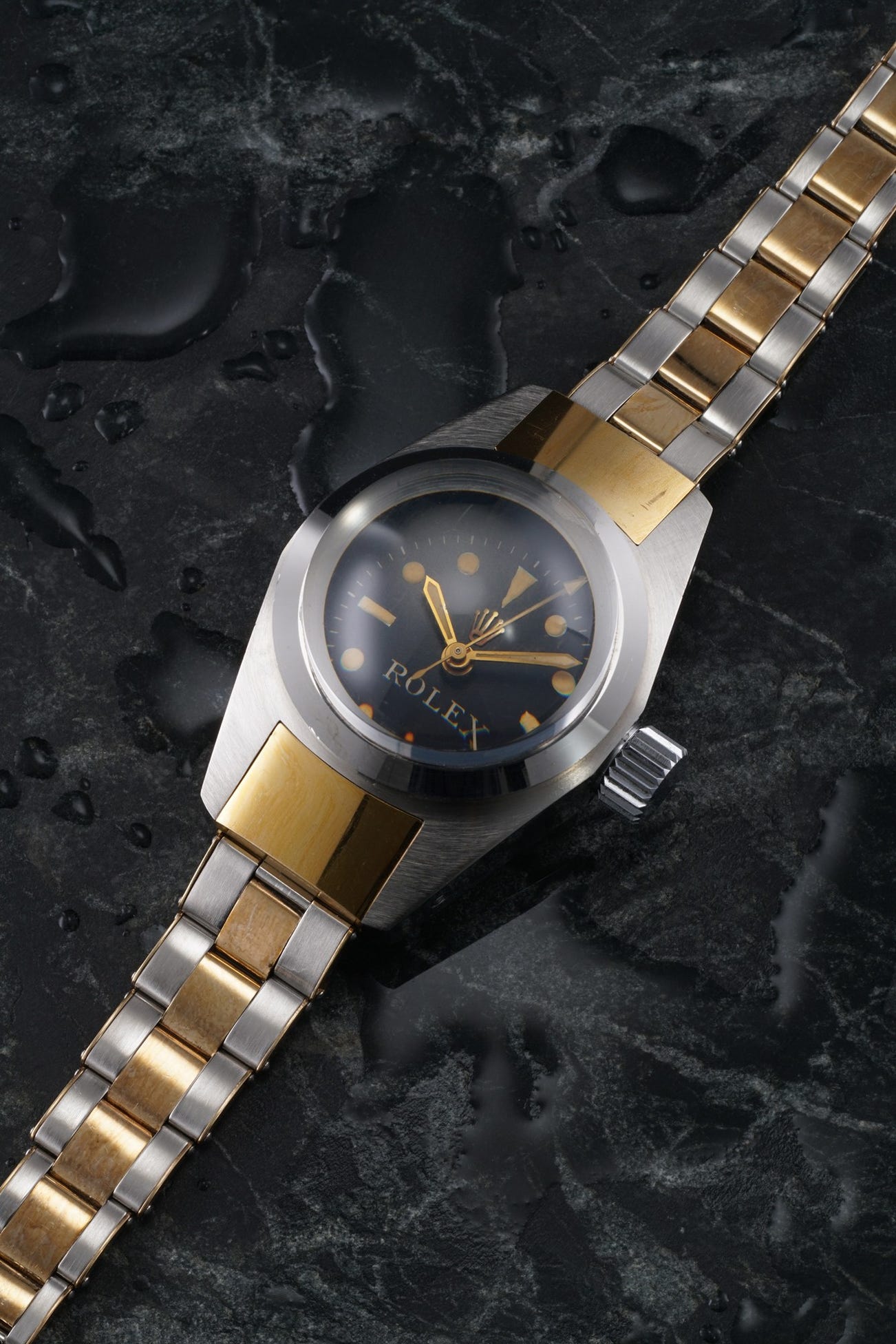 <p><strong>ROLEX</strong> A historically important, extraordinary and museum quality stainless steel and gold ultra-deep dive wristwatch with center seconds, made in 1965.</p>