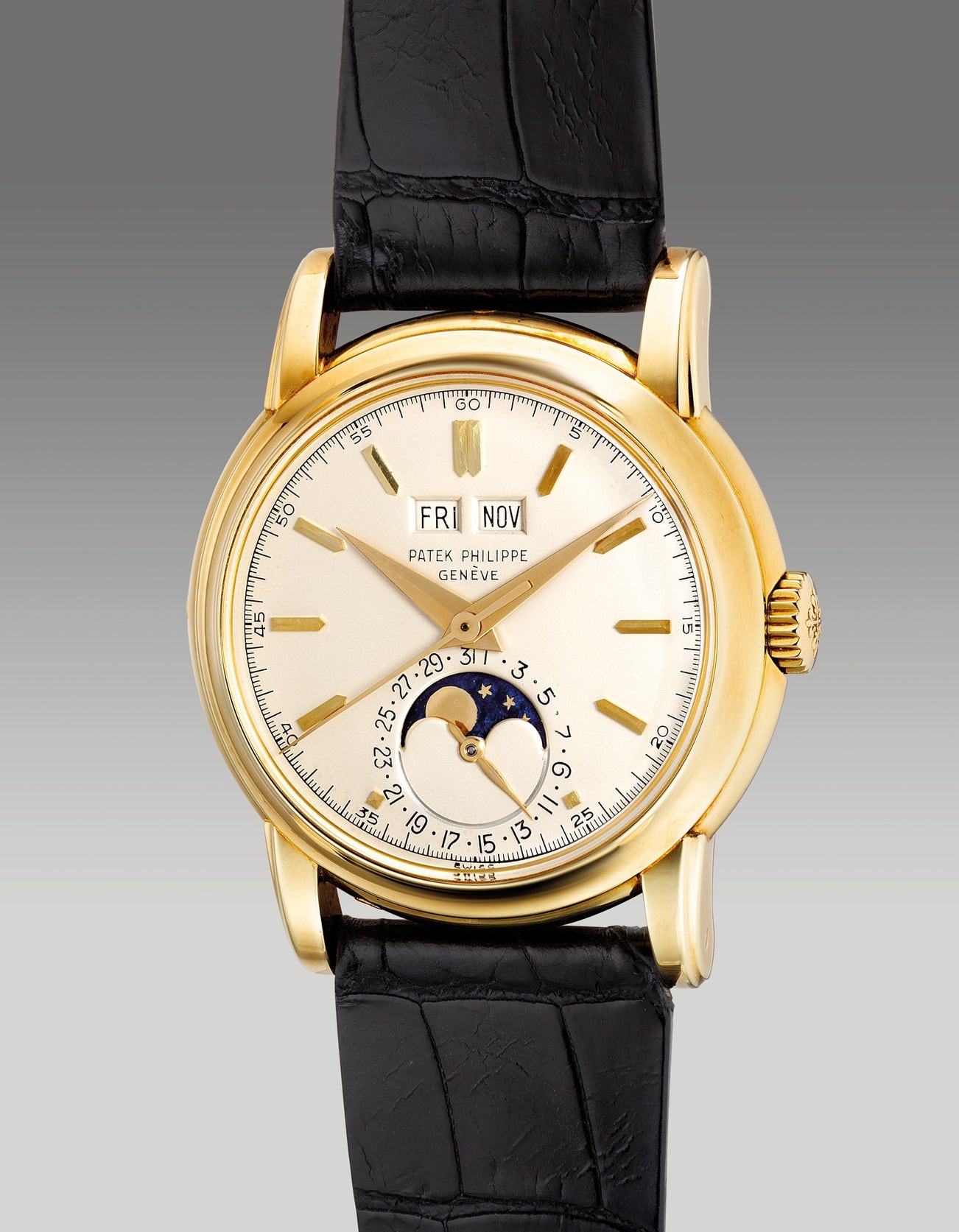 <p><strong>PATEK PHILLIPE</strong> ref.2438 - A very fine and extremely rare yellow gold perpetual calendar wristwatch with center seconds, moon phases, screw-down caseback and presentation box, circa 1955</p>
