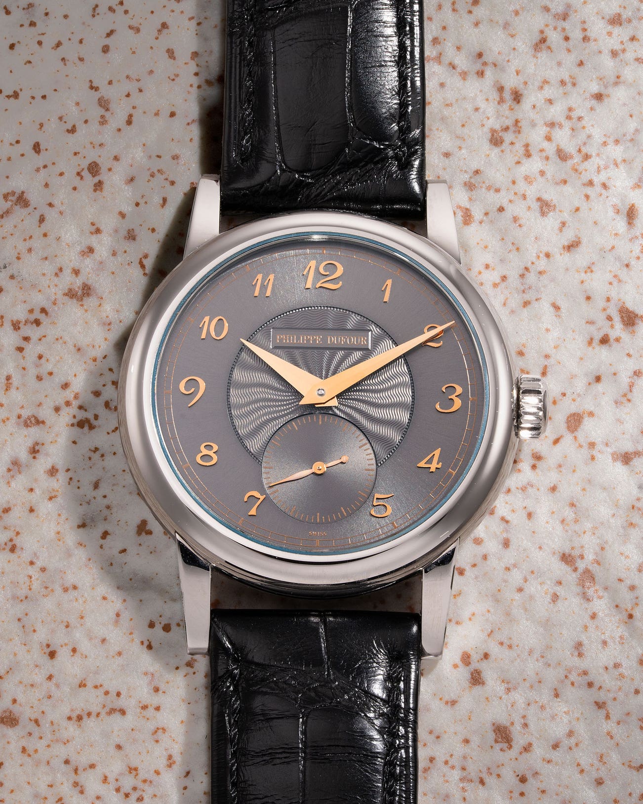 <p><strong>PHILIPPE DUFOUR</strong> <em>Simplicity</em>, An exquisite, extremely rare, first time to appear publicly and only known stainless steel wristwatch with grey guilloché dial, Breguet numerals, HK$2,800,000-5,600,000</p>