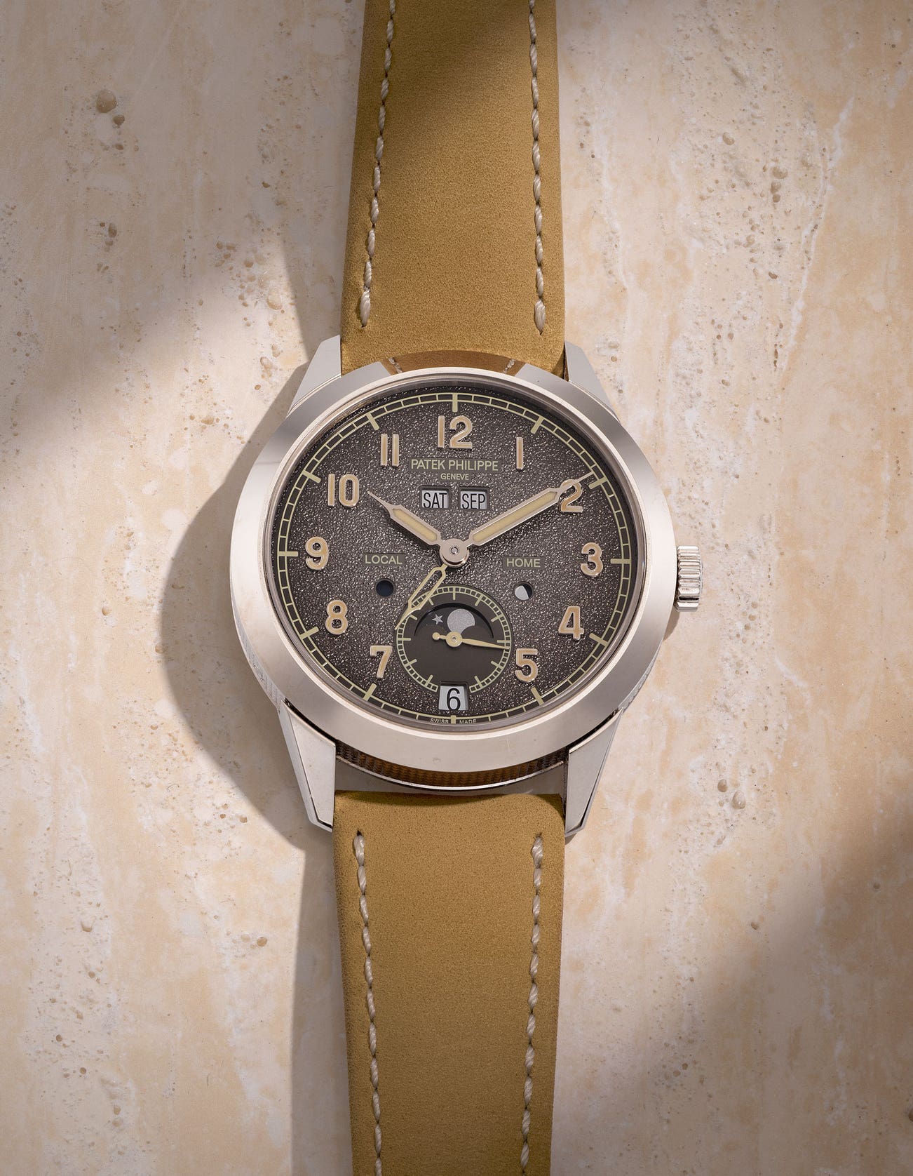 <p><strong>PATEK PHILIPPE</strong> <em>Annual Calendar Travel Time Ref. 5326G-001 in white gold</em>, HKD 280,000 &ndash; 480,000</p>
