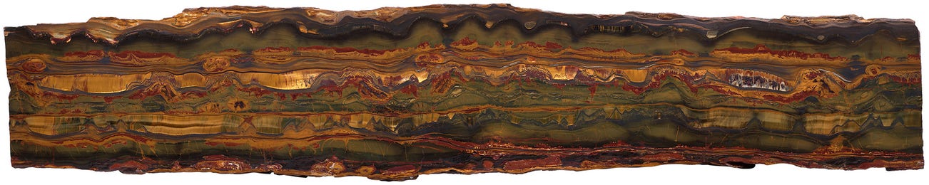 <p><strong>MARRA MAMBA TIGER EYE</strong>&nbsp;<em>Early Proterozoic, 2.5 billion years</em></p>

