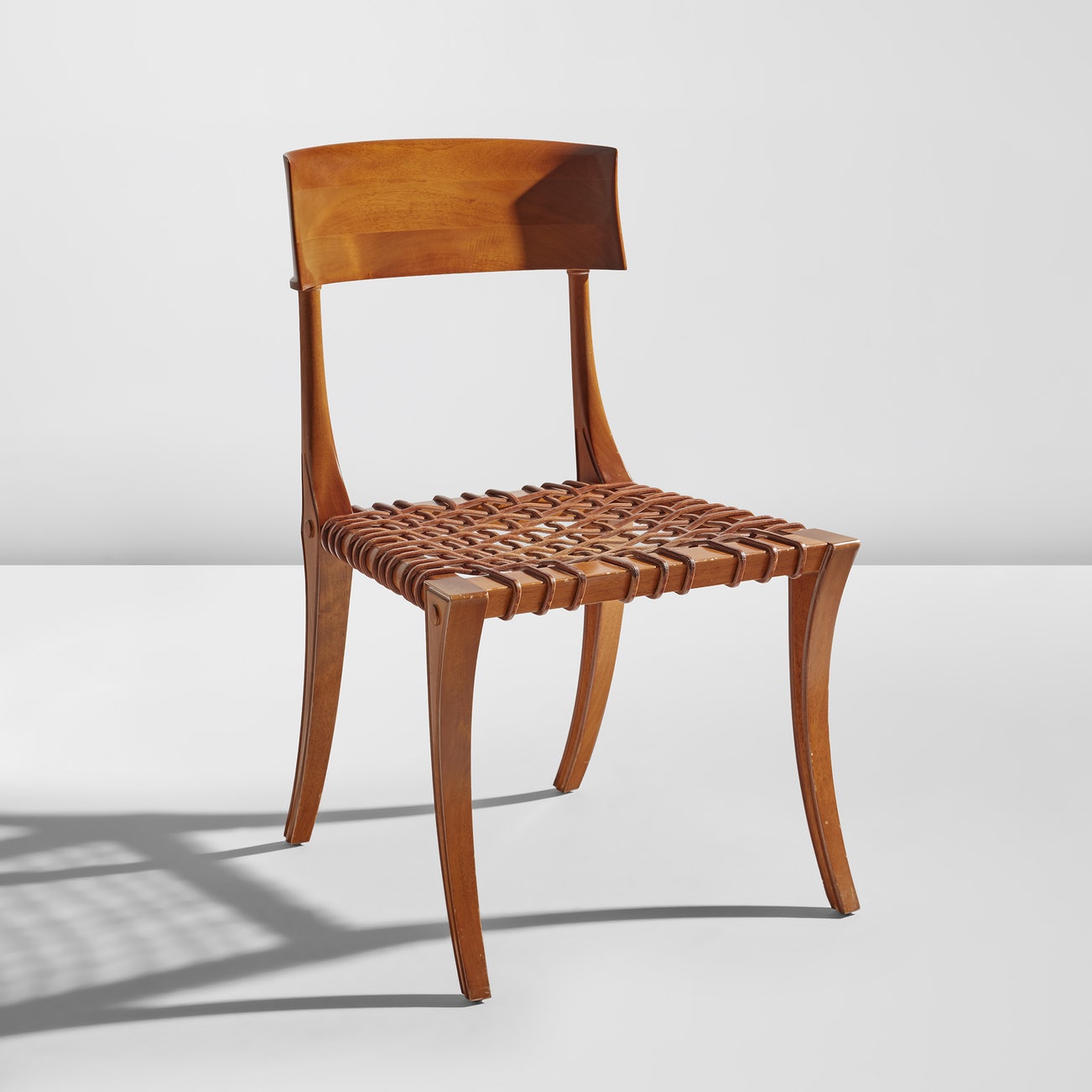 <p><strong>T.H. ROBSJOHN-GIBBINGS </strong><em>"Klismos" chair, model no. 15,</em> $2,500 &ndash; 3,500</p>
