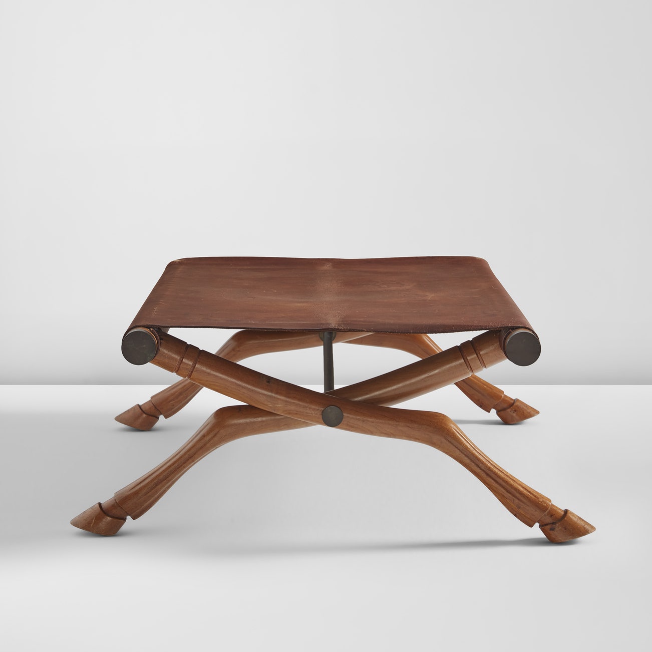 <p><strong>T.H. ROBSJOHN-GIBBINGS</strong> <em>"Diphros Okladias" folding stool, model no. 9,</em> $2,500 &ndash; 3,500</p>
