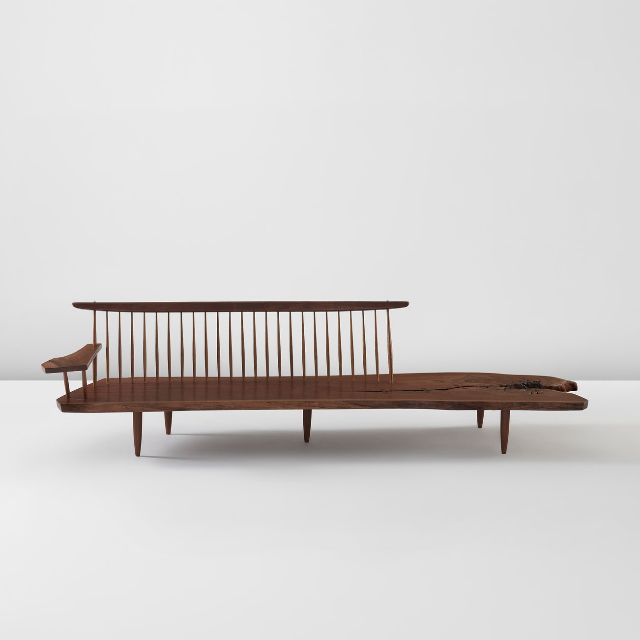 <p><strong>GEORGE NAKASHIMA</strong> <em>Rare</em> <em>"Conoid" bench with single free-form arm,</em> $120,000–180,000</p>
