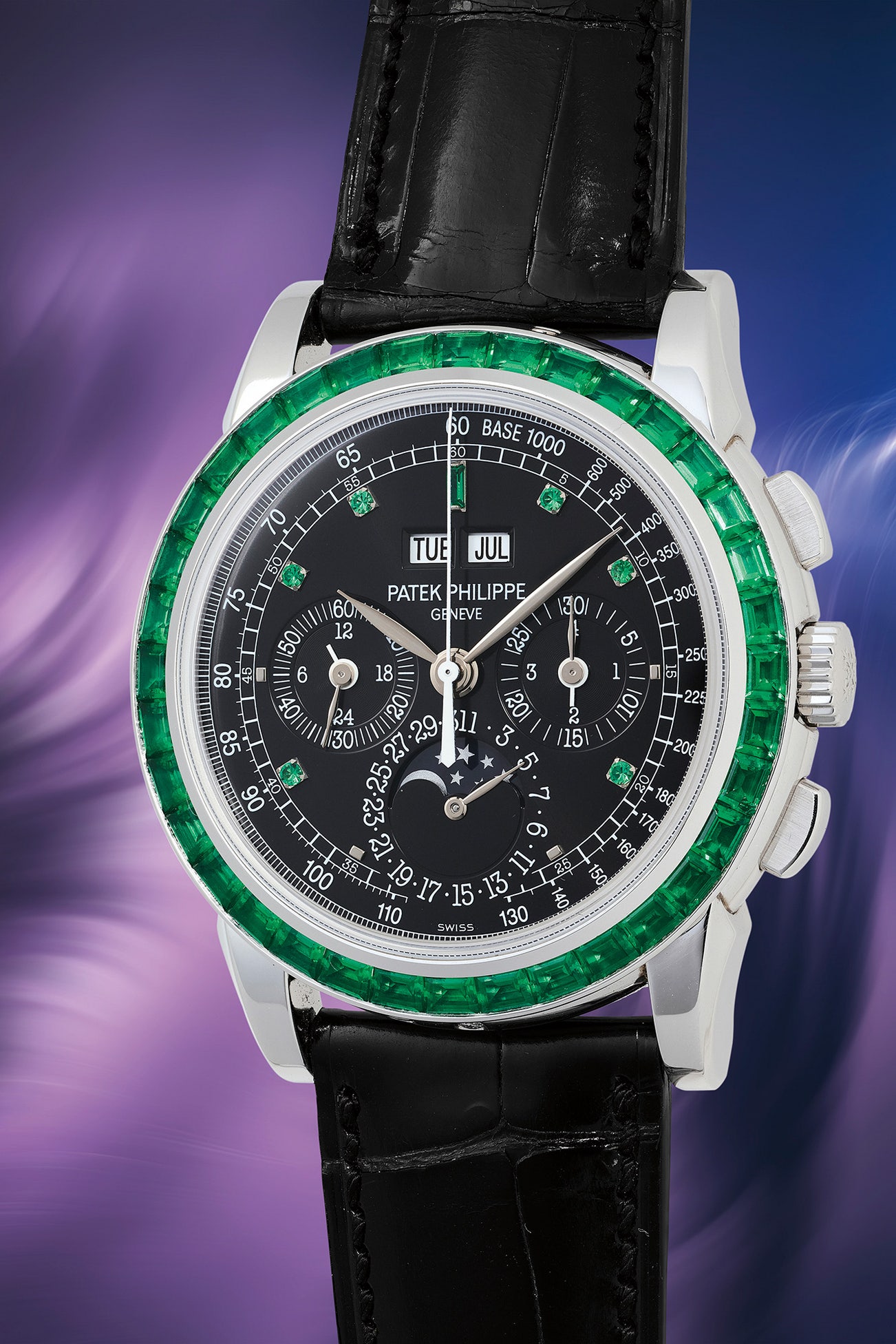 <p><strong>PATEK PHILIPPE.<em> </em></strong><em>Ref. 5971/13P-010 in platinum with emeralds</em>, $600,000 -1,200,000</p>

