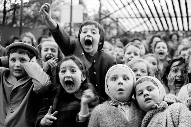 Children watched the story of “Saint George and the Dragon” at an outdoor puppet theater in Paris, 1963. Alfred Eisenstaedt/Life Pictures/Getty Images