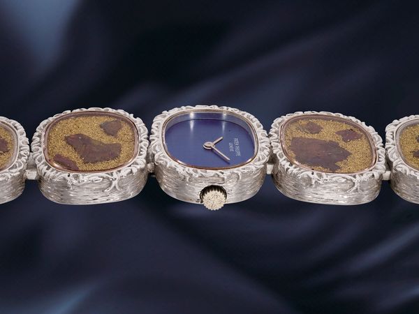 Lot 835: A 1971 Patek Philippe Ref. 4119/1 in 18K white gold, bronze powder and chalcopyrite, included in the Phillips Hong Kong Watch Auction: XXII. Estimate: HKD $150,000–300,000