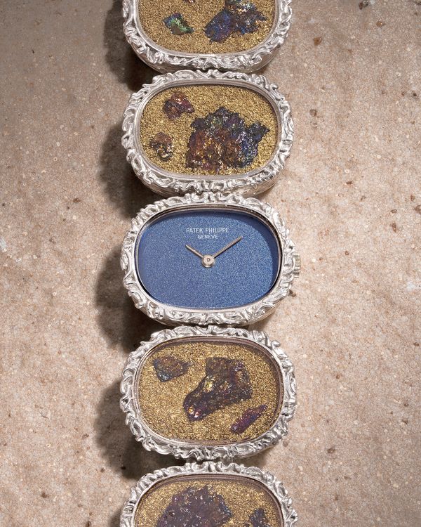 Lot 835: A 1971 Patek Philippe Ref. 4119/1 in 18K white gold, bronze powder and chalcopyrite, included in the Phillips Hong Kong Watch Auction: XXII. Estimate: HKD $150,000–300,000