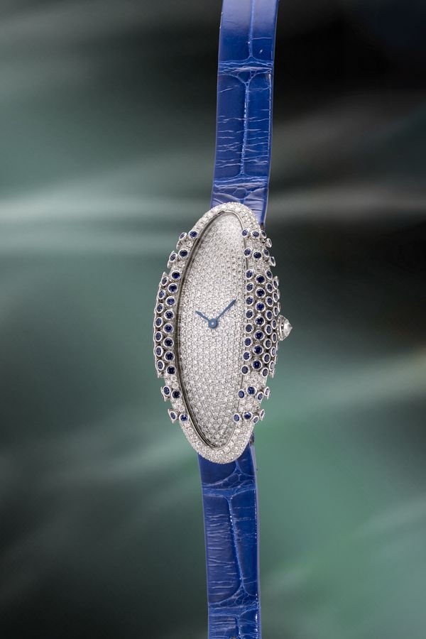 Lot 1057: A circa 2019 Libre Baignoire Allongée with pavé-set diamonds and blue sapphires, 18k white gold, included in the Phillips Hong Kong Watch Auction: XXII. Estimate: HK$300,000 -600,000.