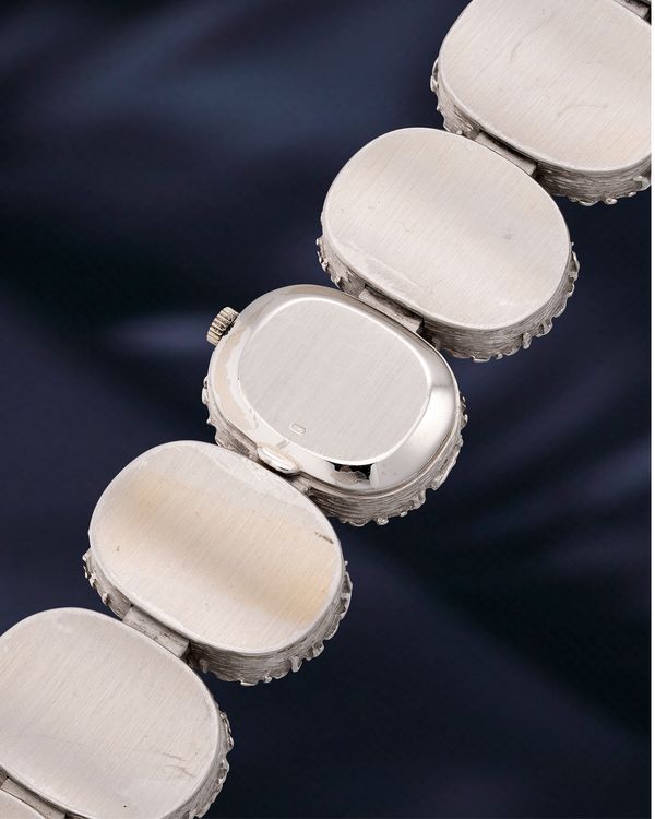 Lot 835: A 1971 Patek Philippe Ref. 4119/1 in 18K white gold, bronze powder and chalcopyrite, included in the Phillips Hong Kong Watch Auction: XXII. Estimate: HKD $150,000–300,000