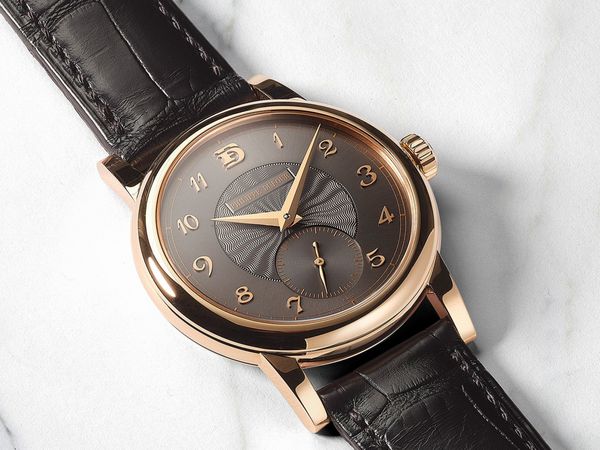 A 2020 Philippe Dufour Simplicity 20th Anniversary in 18k pink gold with and-guilloché dial and PD initials at 12 o’clock.