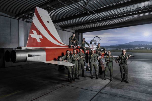 Patrouille Suisse team in front of their airplane