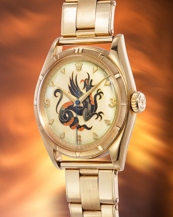 1952 Rolex 'The Dragon' Ref. 6085 in 18k yellow gold with cloisonné enamel dial by Nelly Richard, included in the Phillips Geneva Watch Auction: XXIII.