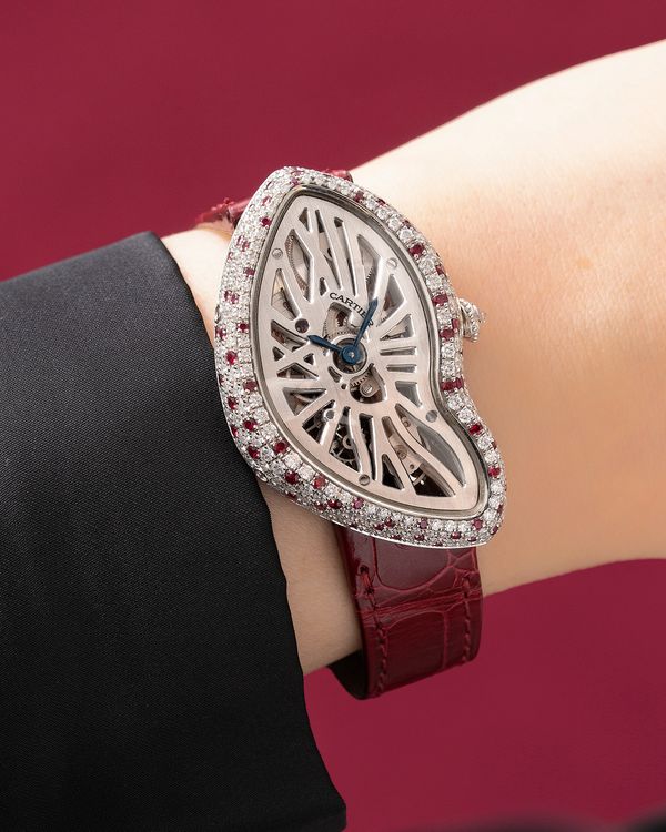 Lot 853: A 2017 Cartier Ref. CRHPI01088 Crash Squelette No. 1. in platinum set with diamonds and rubies, included in The Phillips Hong Kong Watch Auction: XXII. Estimate: HK$1,000,000–2,000,000.