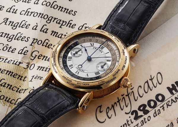 A circa 1991, unique Franck Genève 'Janus' World-Time Single-Button, Double-Sided Chronograph in 18k yellow gold that's included in the Phillips Geneva Watch Auction: XXIII.