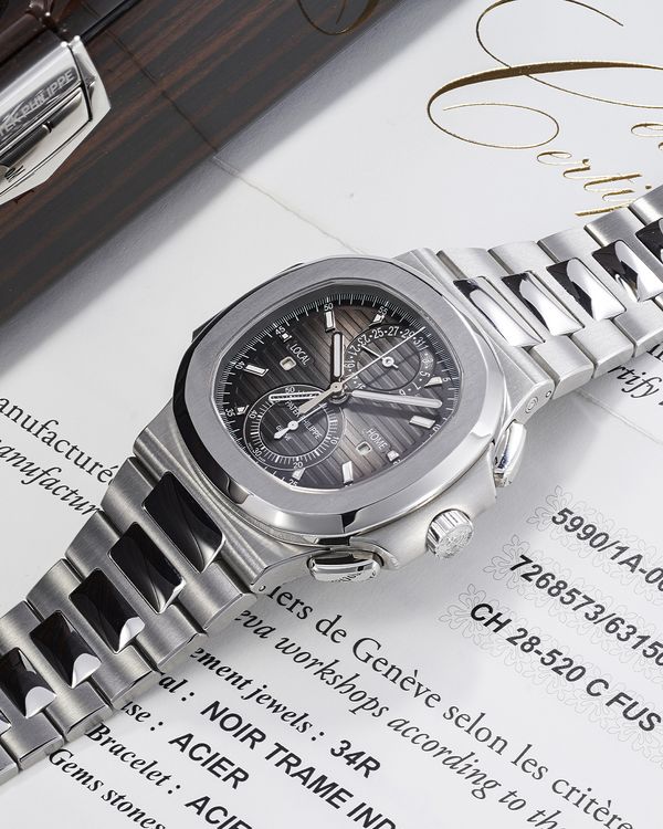 Lot 201: A 2019 Patek Philippe Nautilus Travel-Time Flyback Chronograph Ref. 5990/1A-001 in stainless steel that's included in the Phillips Geneva Watch Auction: XXIII. Estimate: CHF 40,000 - 80,000