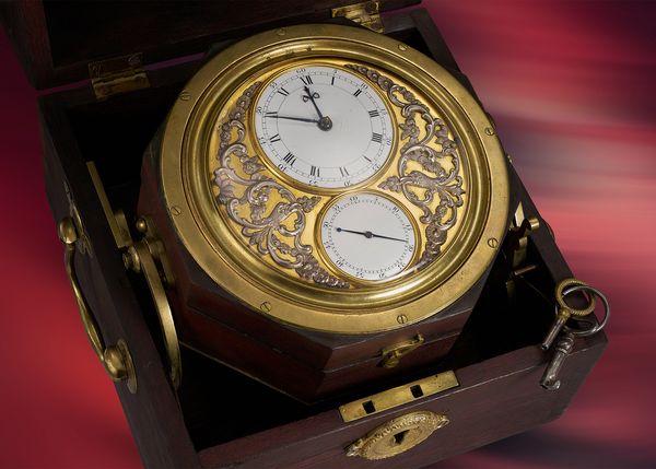 A circa 1797 Robert Pennington and Richard Pendleton gilt and wood one-day marine chronometer, signed No. 25, and based on the work of Thomas Mudge. Included in the Phillips Geneva Watch Auction: XXIII.