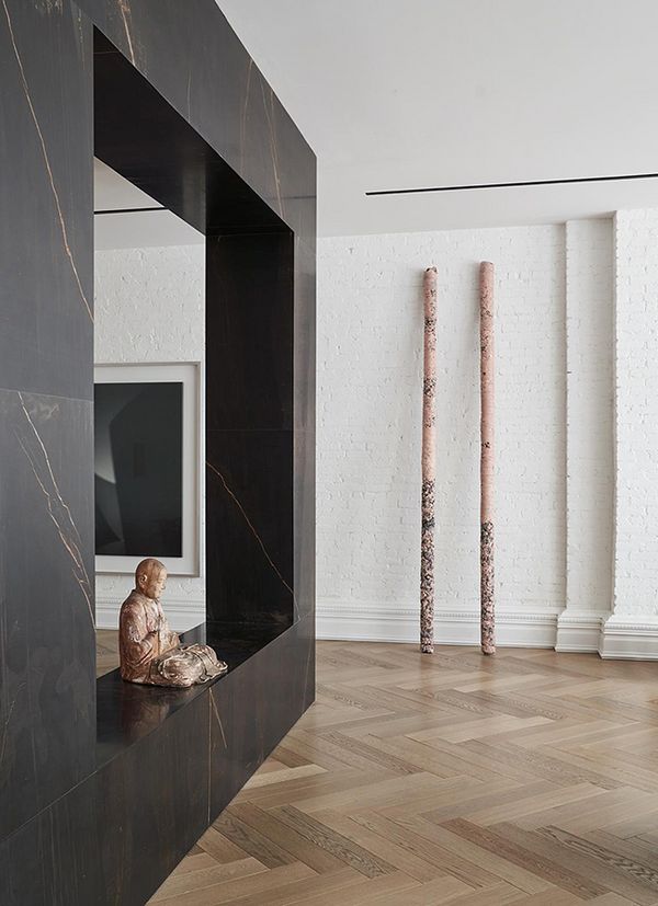 Helmut Lang’s Untitled, 2010–2013, rests against the wall in Phillip Lim’s home in conversation with the Buddha statue and the work by Hiroshi Sugimoto.