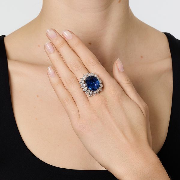 Lot 389: Sapphire and diamond ring. Burmese sapphire weighing 19.93 carats, no heat. Estimates: CHF320,000–480,000 / US$395,000–600,000.