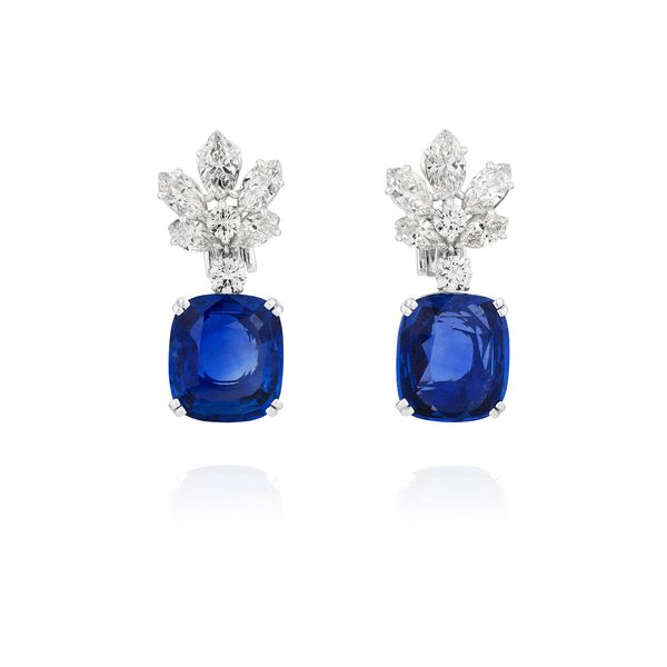 Lot 390: Pair of sapphire and diamond earrings. Ceylon sapphires weighing 12.31 and 12.69 carats, no heat. Estimates: CHF175,000–190,000 / US$185,000–240,000.