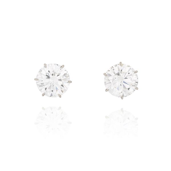 Pair of fine diamond studs weighing 8.00 and 8.28 carats respectively, D colour, VVS1 clarity.