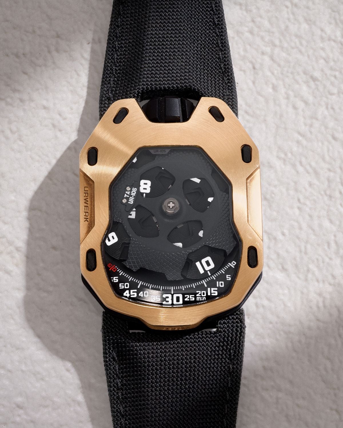 Lot 8020: A circa 2015 Urwerk UR-105 TA “Knights” Ref. UR-105 TA RG in titanium and 18k pink gold, included in the Phillips Hong Kong Sessions, Fall 2026. Estimate: HKD $100,000–200,000