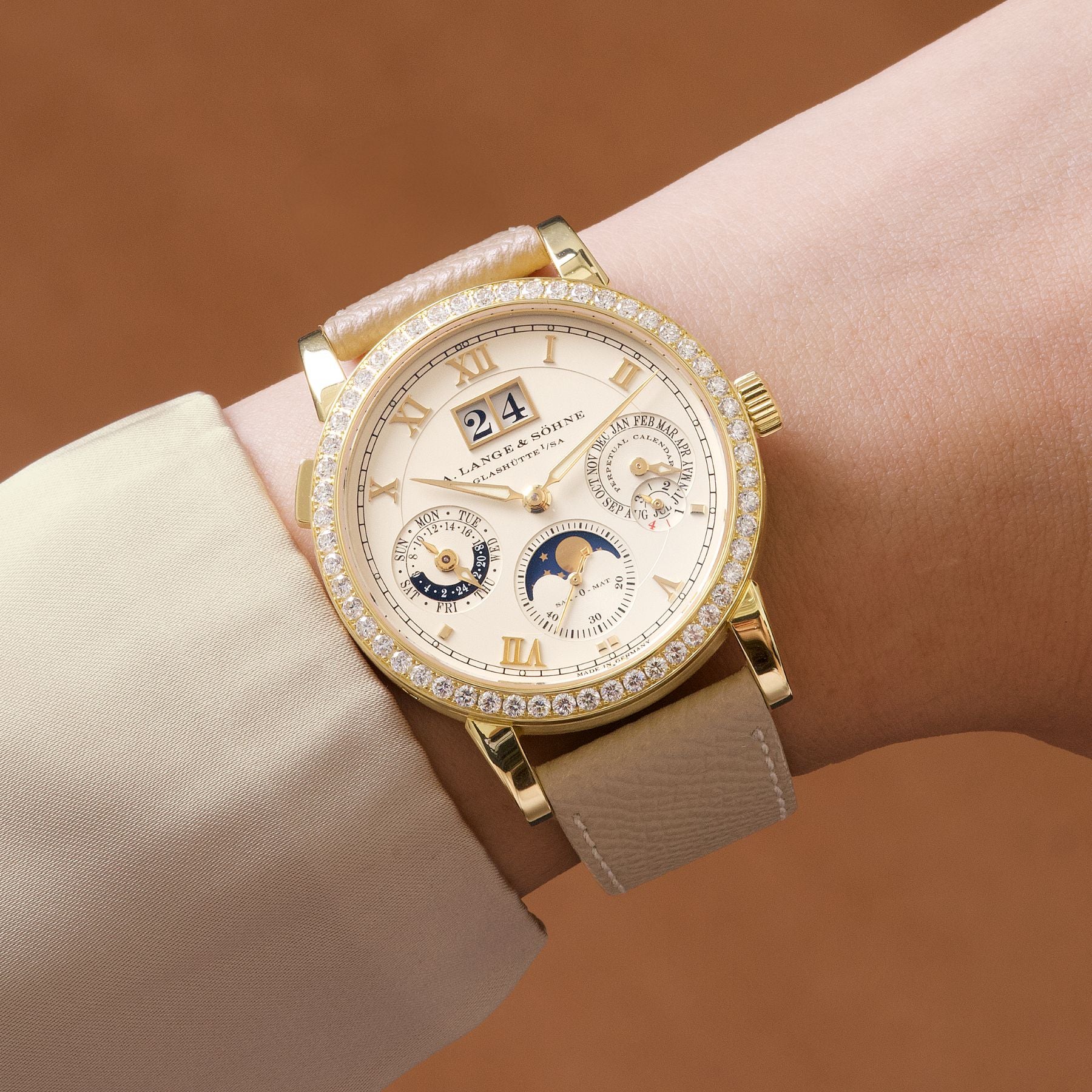 Lot 8051: A circa 2005 A. Lange & Söhne Saxonia Langematik Perpetual Ref. 820.021E in 18k yellow gold with a diamond-set bezel, included in the Phillips Hong Kong Sessions, Fall 2026. Estimate: HKD $220,000–450,000