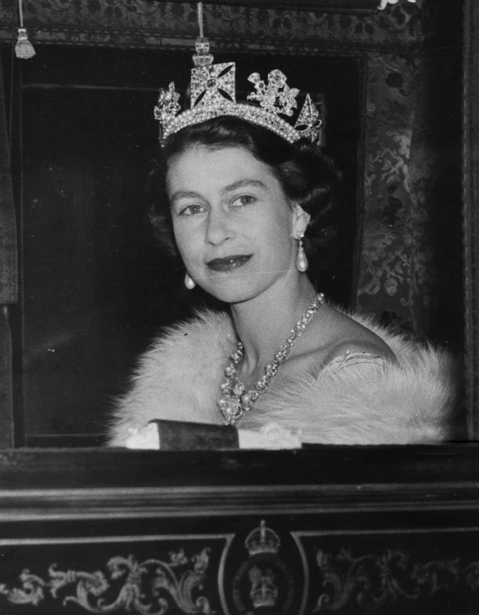 Queen Elizabeth II en route for the first State Opening of Parliament under her reign, wearing the original Golden Jubilee Necklace, 4th November 1952.