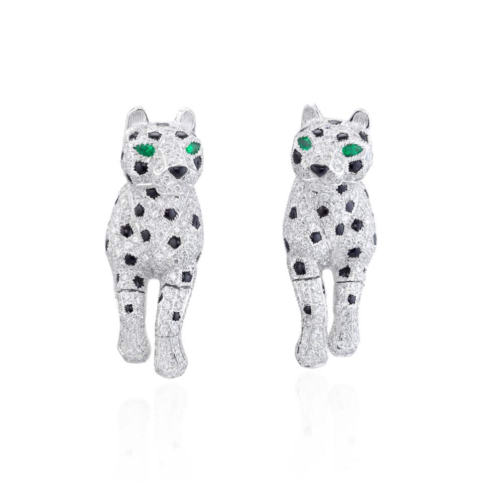 Cartier Pair of diamond, onyx and emerald earrings, 'Panthère' Phillips Hong Kong Jewels Auction