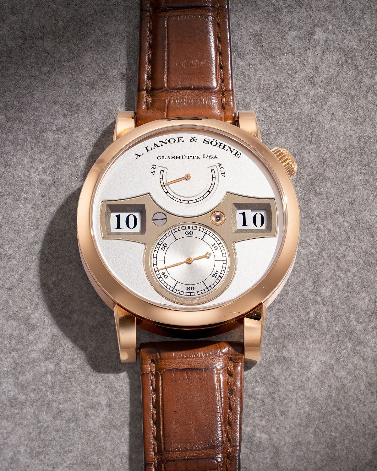 Lot 8050: A circa 2020 A. Lange & Söhne Zeitwerk Ref. 140.032F in 18k pink gold, included in the Phillips Hong Kong Sessions, Fall 2026. Estimate: HKD $250,000–450,000