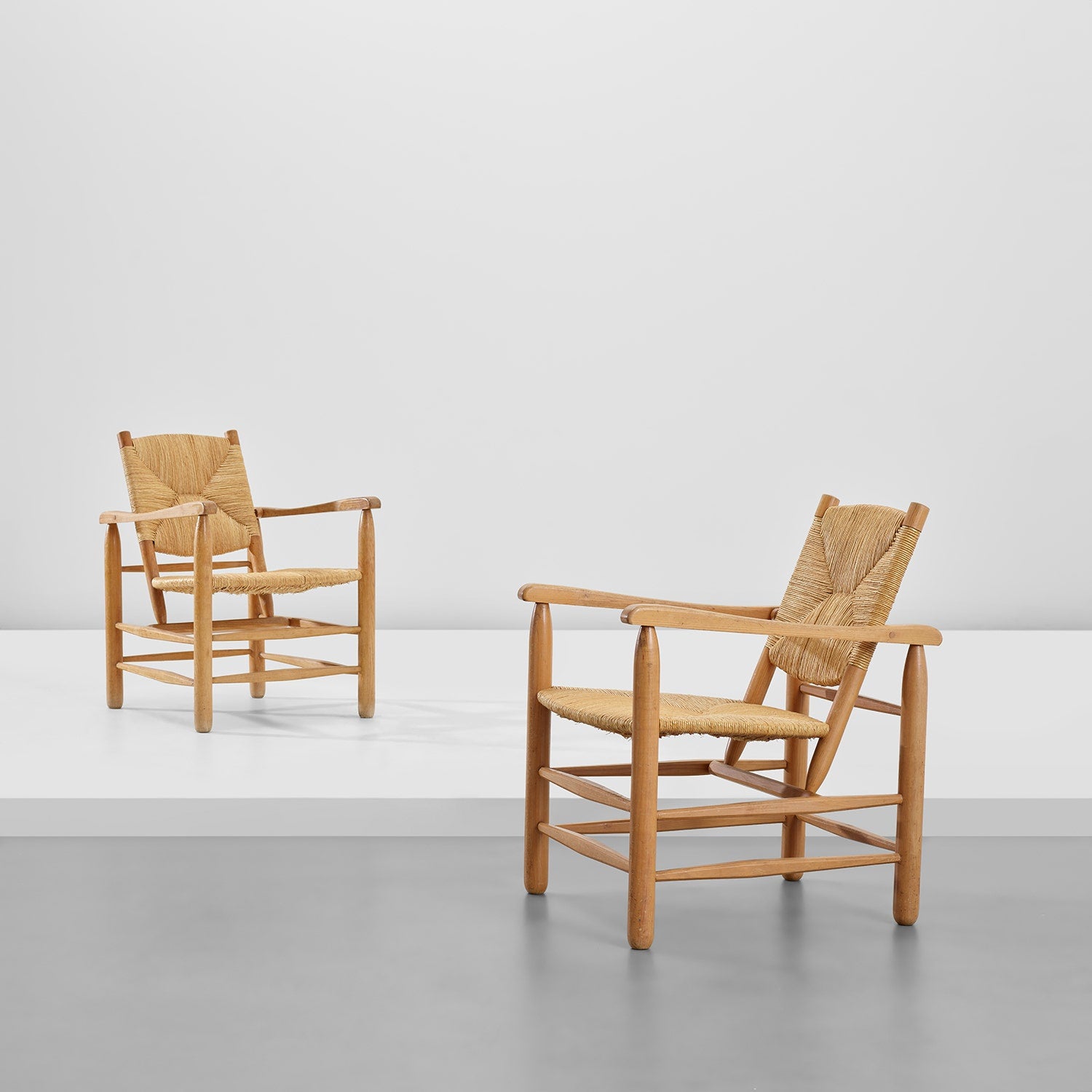 Charlotte Perriand Pair of armchairs, model no. 21