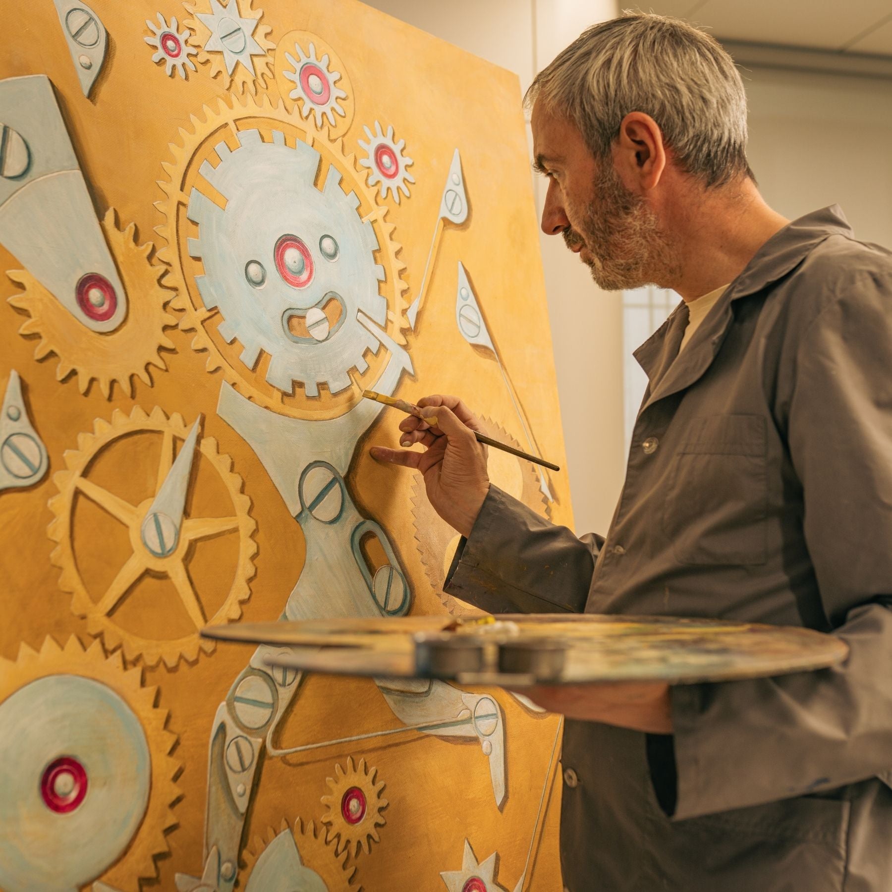 Konstantin Chaykin painting a watch. 
