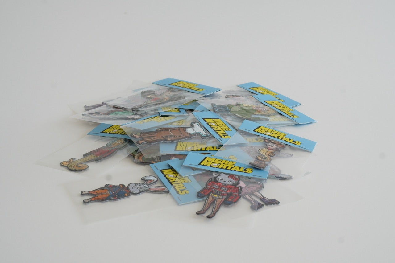 Merchandise from Cj Hendry's 'Mere Mortals' collection.
