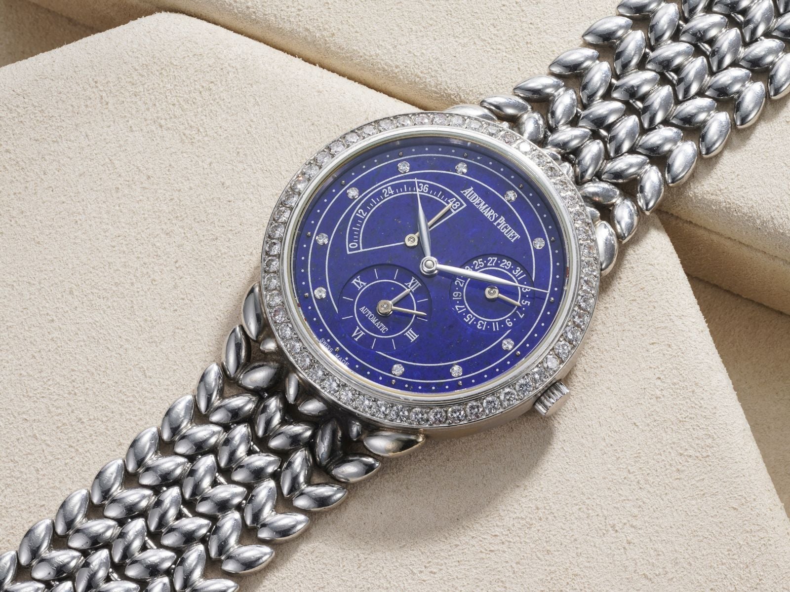 Lot 41: A 1997 Audemars Piguet Jules Audemars Dual-Time Ref. 25754 in platinum with lapis lazuli dial and diamond-set bezel and indexes, included in the Phillips Geneva Sessions, Fall 2026, Online Auction. Estimate: CHF 12,000–24,000