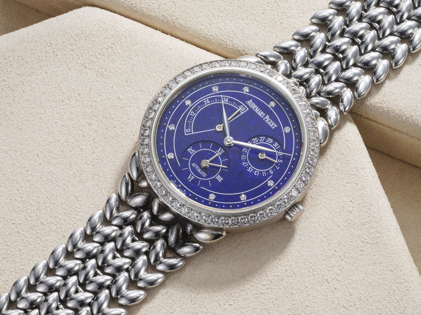 Lot 41: A 1997 Audemars Piguet Jules Audemars Dual-Time Ref. 25754 in platinum with lapis lazuli dial and diamond-set bezel and indexes, included in the Phillips Geneva Sessions, Fall 2026, Online Auction. Estimate: CHF 12,000–24,000