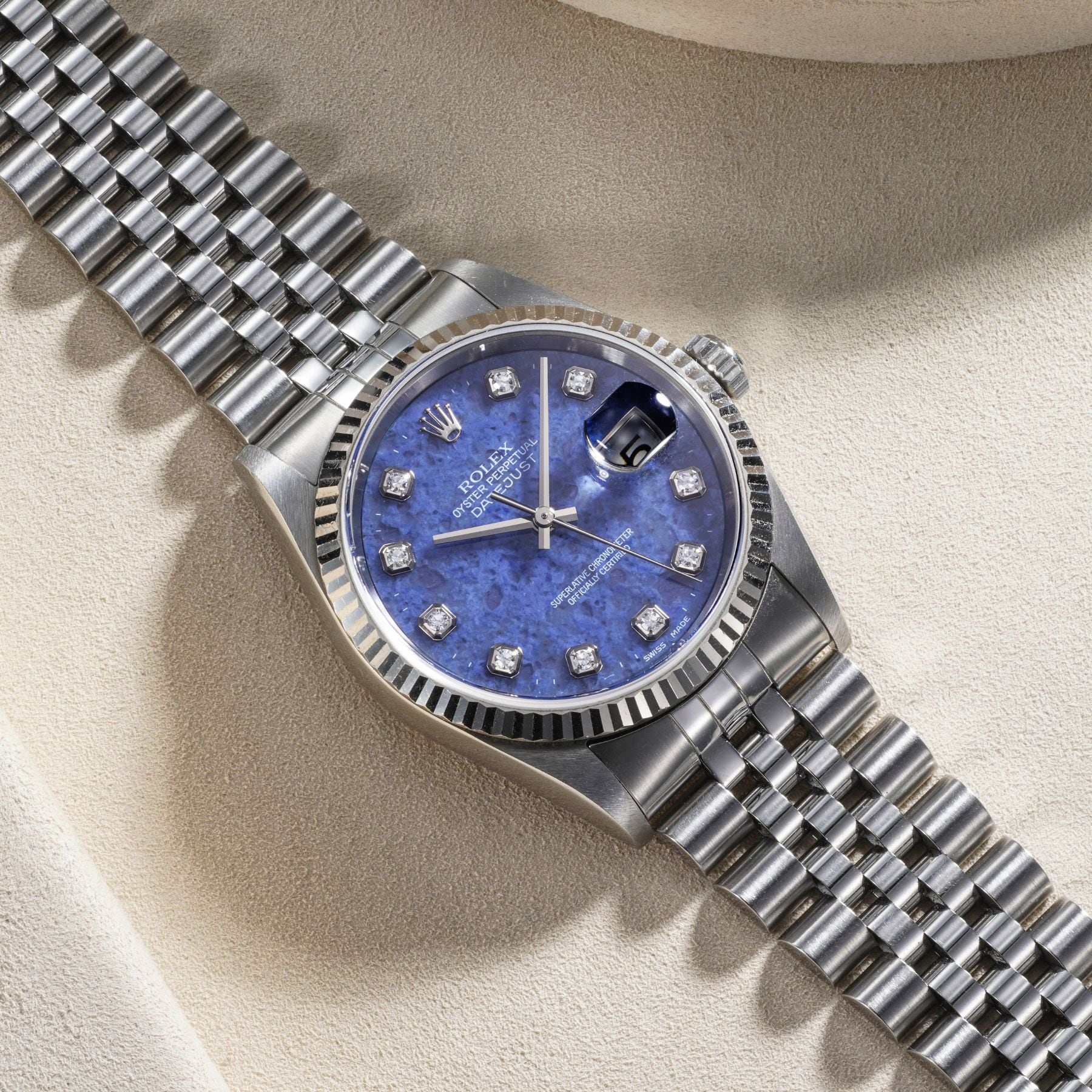 Lot 22: A 2000 Rolex Datejust Ref. 16234 in stainless steel with blue sodalite dial and diamond-set indexes, included in the Phillips Geneva Sessions, Fall 2026, Online Auction. Estimate: CHF 7,000–14,000