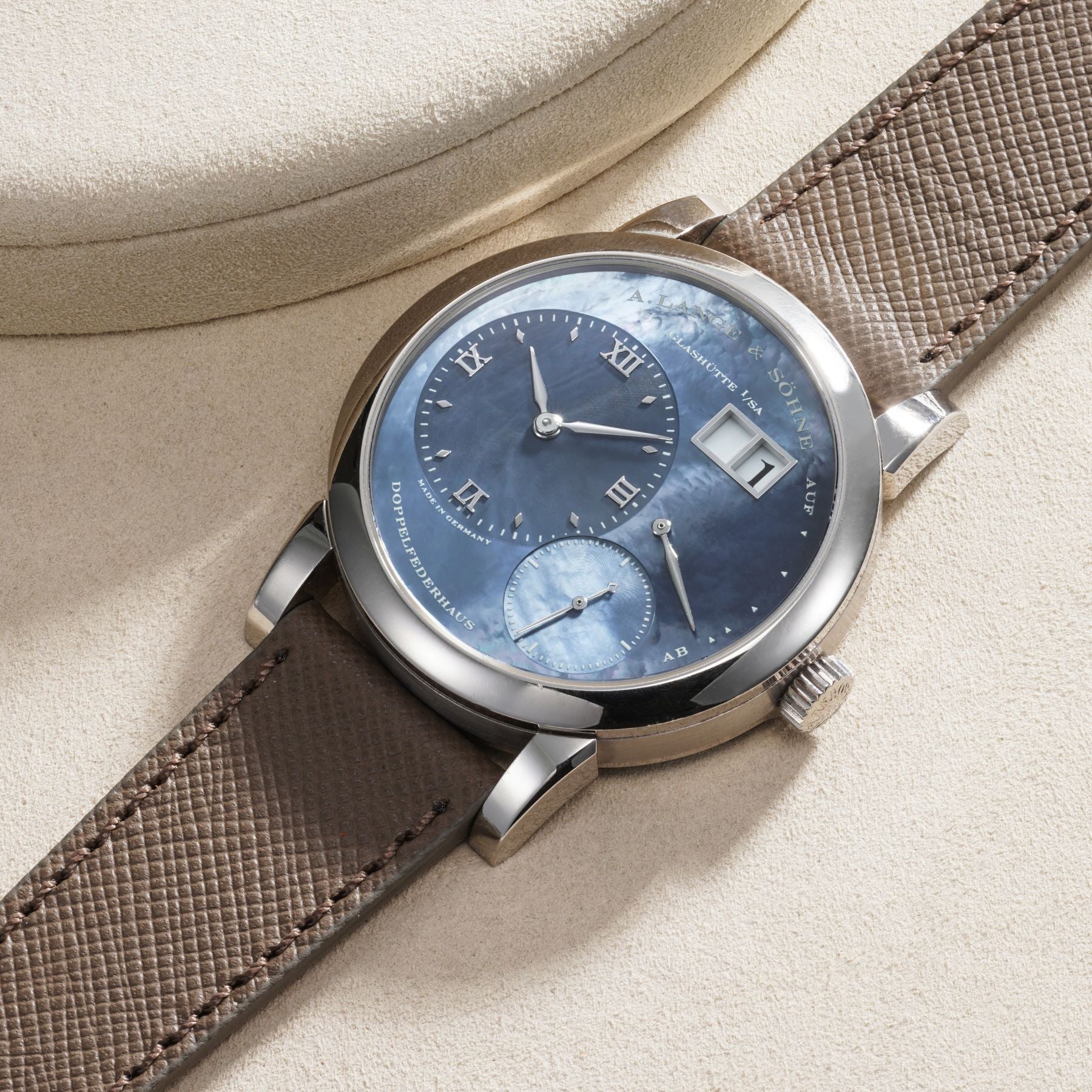 Lot 61: A circa 2003 A. Lange & Söhne Lange 1 Limited Edition for Dubail Paris in white gold with a blue mother-of-pearl dial, No. 19 of a 25-piece limited edition, included in the Phillips Geneva Sessions, Fall 2026, Online Auction. Estimate: CHF 35,000–70,000