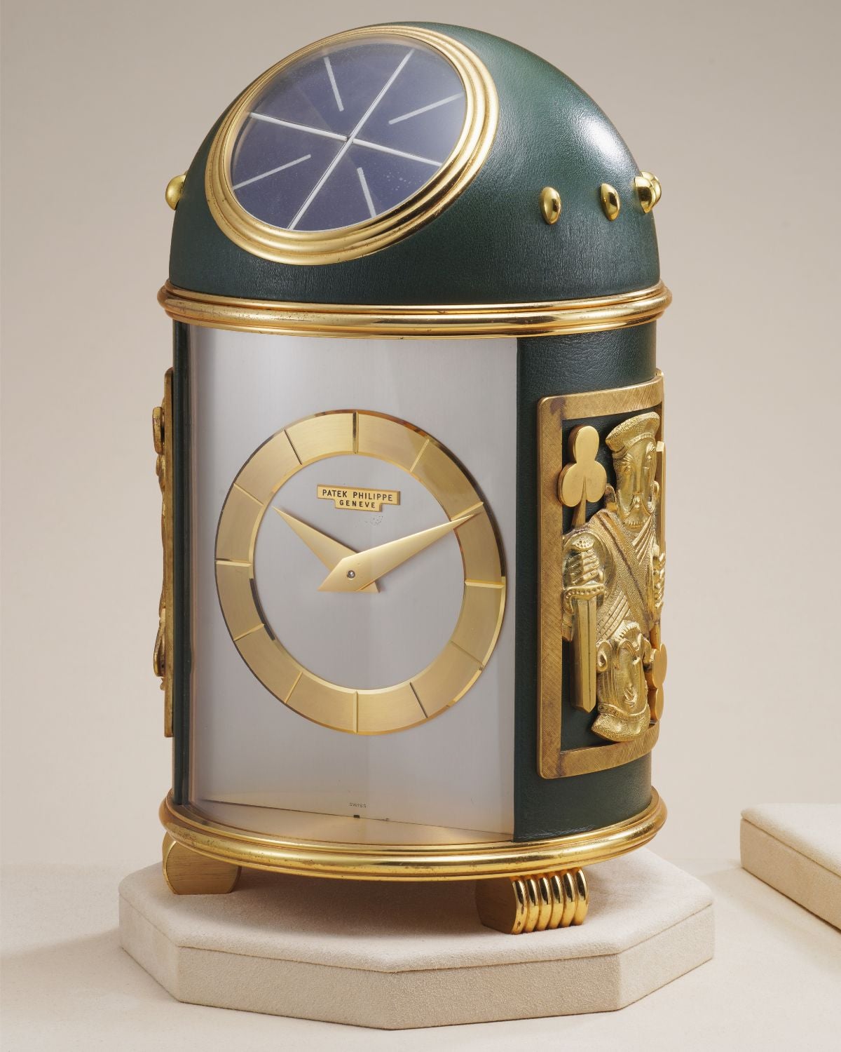 Lot 10: A 1965 Patek Philippe Ref. 725 “Bridge Cards” Dome Clock in gilt brass and green leather, included in the Phillips Geneva Sessions, Fall 2026, Online Auction. Estimate: CHF 40,000–80,000