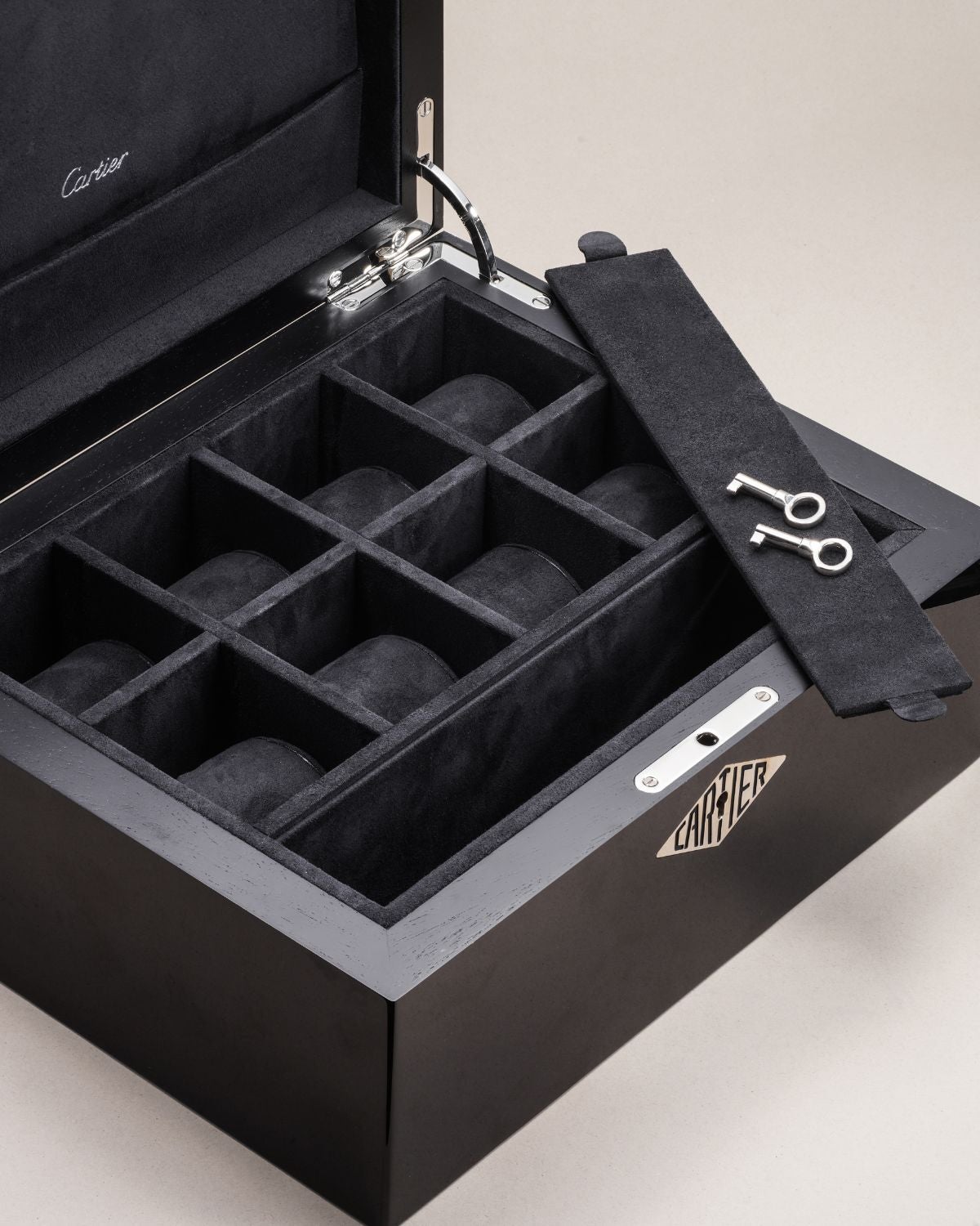 Lot 93: A limited-edition Cartier watch box in red grained leather and black lacquer with chemin de fer decoration, included in the Phillips Geneva Sessions, Fall 2026, Online Auction. Estimate: CHF 3,000–6,000