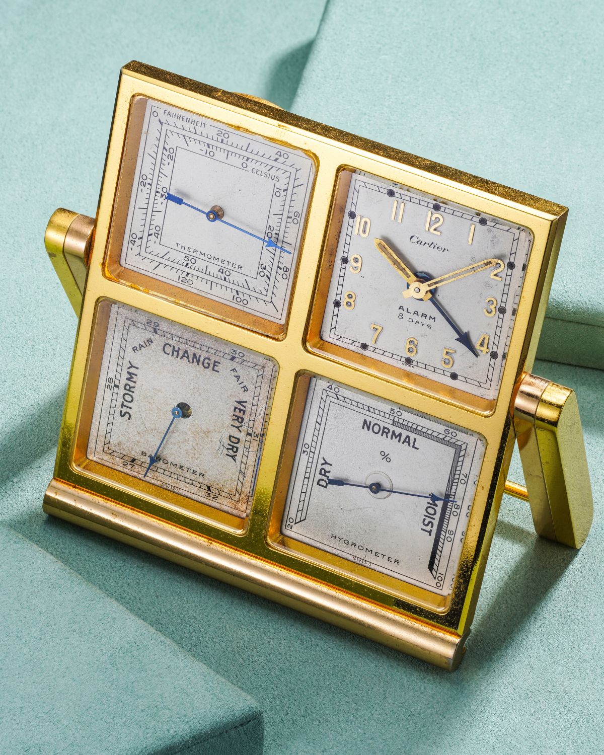 Lot 29: A circa 1950s Cartier eight-day desk clock with alarm, thermometer, barometer, and hygrometer in gilt brass, included in the Phillips Geneva Sessions, Fall 2026, Online Auction. Estimate: CHF 5,000–10,000