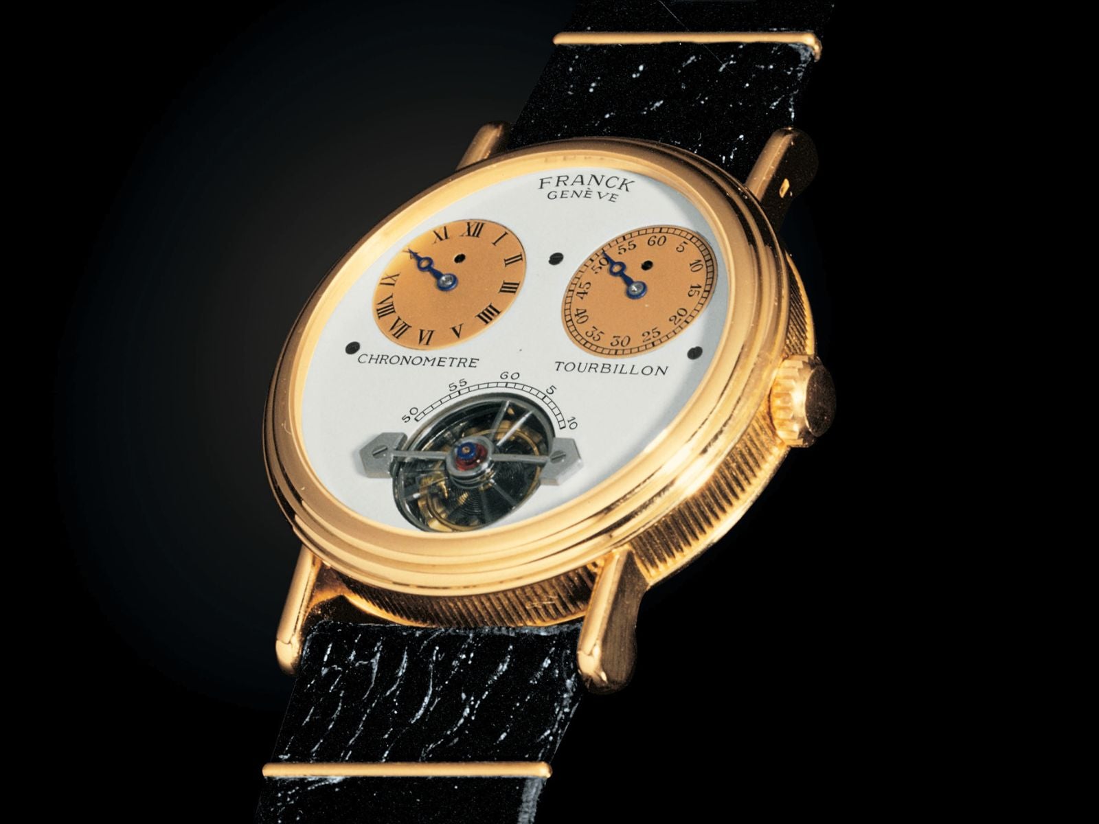 A 1986 Franck Genève jumping-hour tourbillon chronometer, with a regulator-type dial and a case by Jean-Pierre Hagmann. Franck Muller