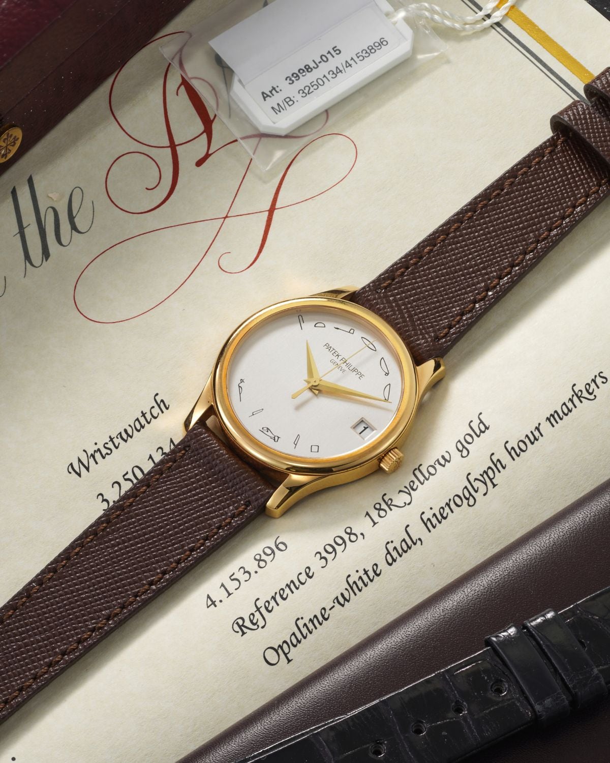 Lot 93: A unique 2002 Patek Philippe Ref. 3998 “VILIP STERKK” with an Egyptian hieroglyph dial in 18k yellow gold, most probably made for Philippe Starck, included in The Geneva Watch Auction XXIV. Estimate: CHF 80,000–160,000