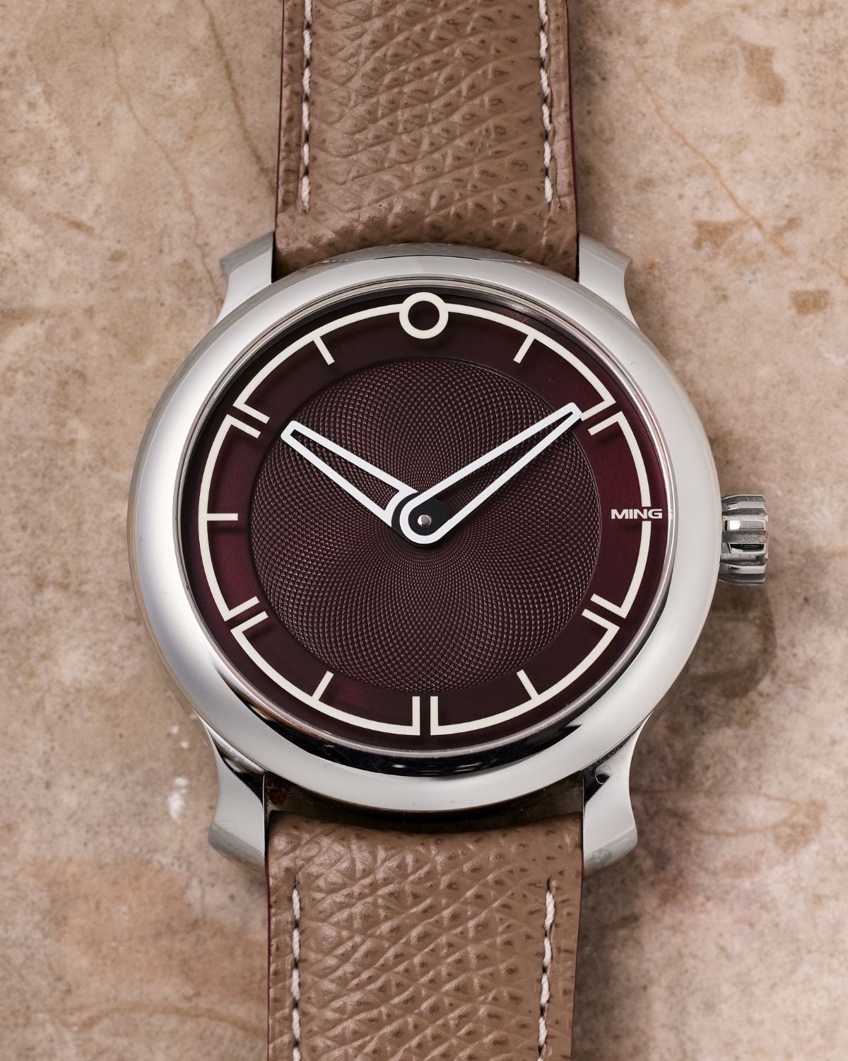 Lot 58: A circa 2021 MING 17.09 Burgundy Ref. 17.09 in stainless steel, included in the Phillips New York Sessions, Fall 2026. Estimate: USD $2,000–4,000