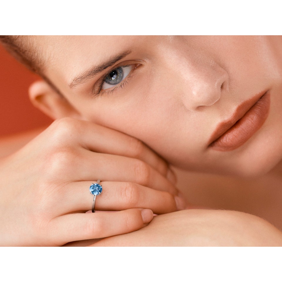 Exceptional Fancy Vivid Blue diamond ring. Brilliant-cut diamond weighing 1.35 carat, Natural Colour, VVS2 Clarity, Excellent Polish and Symmetry.