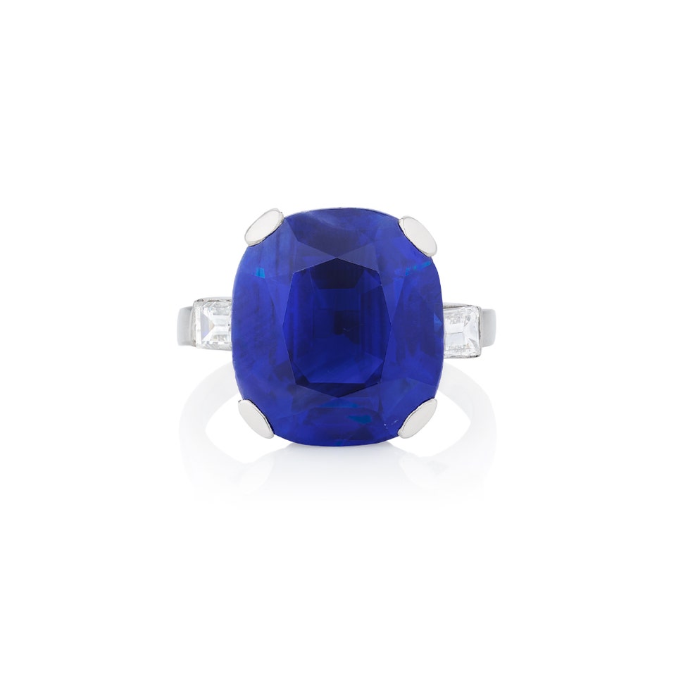 Very fine sapphire and diamond ring. Cushion-shaped sapphire weighing 16.40 carats, Kashmir origin, no indications of heating.